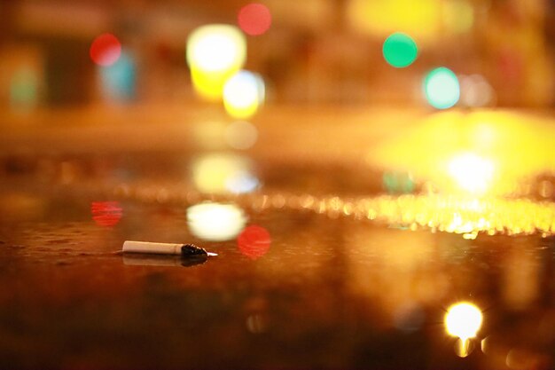 Photo defocused image of illuminated lights on street at night