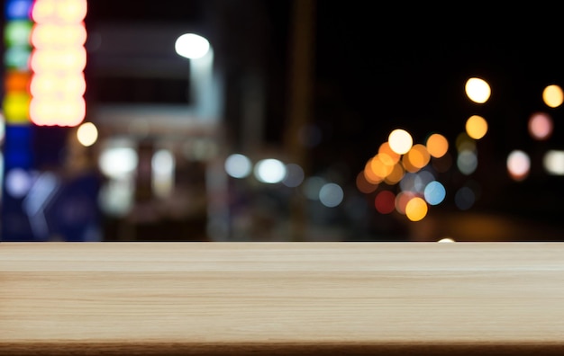 Photo defocused image of illuminated lights on street at night