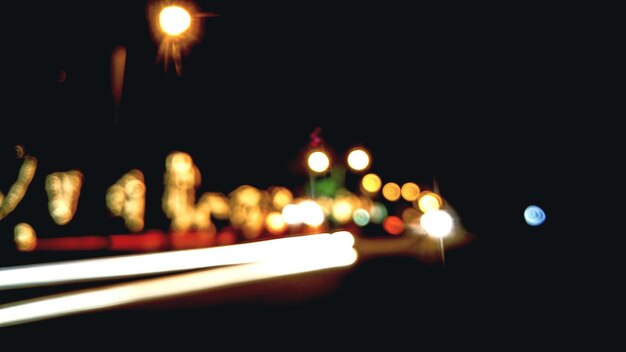 Photo defocused image of lights in city at night