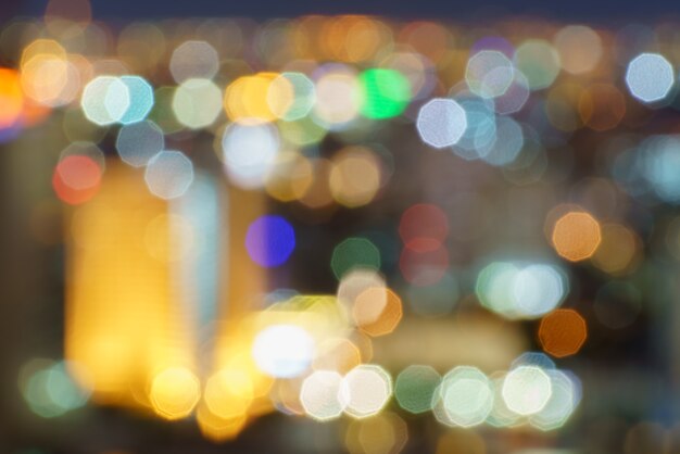 Defocused lights abstract colorful nonagon bokeh background 