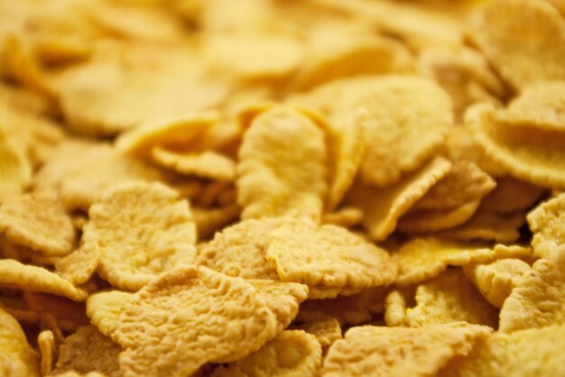 Defocused yellow dry fresh corn flakes background