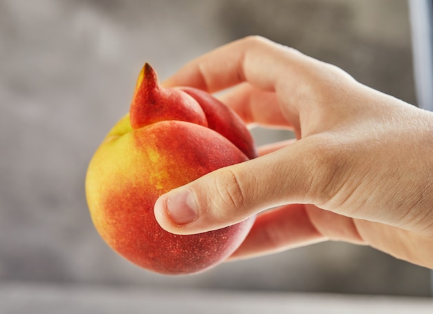 Deformed fresh juicy peach