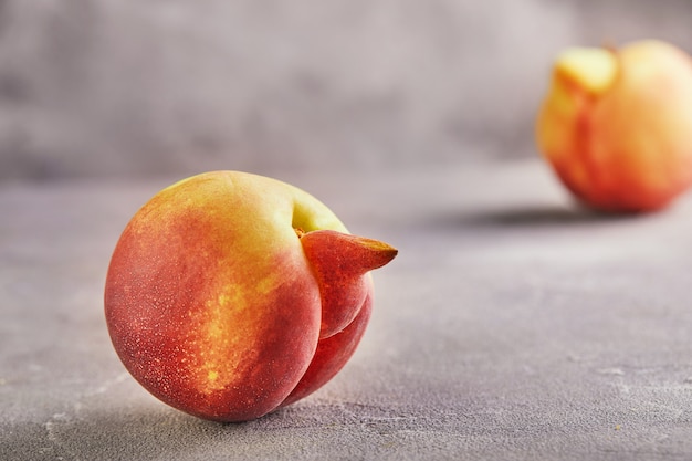 Deformed fresh juicy peaches