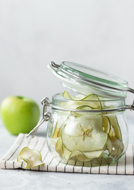 Dehydrated apple chips in glass jar