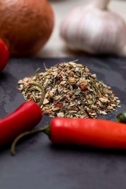 Dehydrated Chimichurri seasoning on black stone with garlic onion and other spices