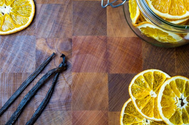 Dehydrated orange Vanilla beans  on wooden table