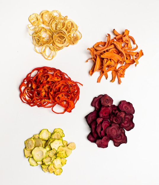 Dehydrated vegetables heap isolated on white as a snack for vegetarians