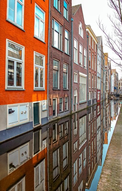 Delft netherlands april 2 2014 reflection of row houses in water canal in city delft