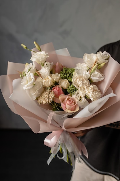 Delicate beautiful bouquet with lisianthus spray rose carnation