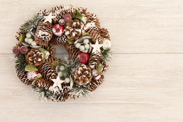 Delicate Christmas wreath of pine cones  