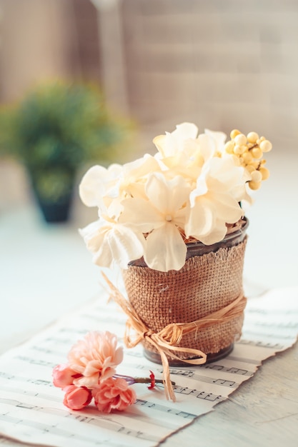 Delicate composition with flowers in a vase