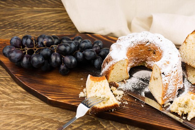 Delicate cottage cheese cake on a wooden board and a rustic table. homemade cakes.