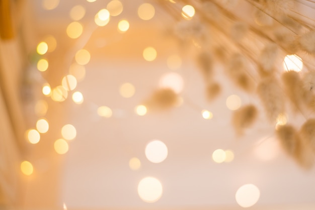 Delicate Golden color against the background of blurred Christmas lights