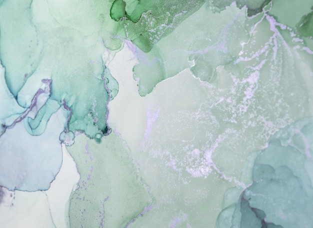 Delicate green and gray abstract watercolor pattern showcasing organic shapes and soft blending