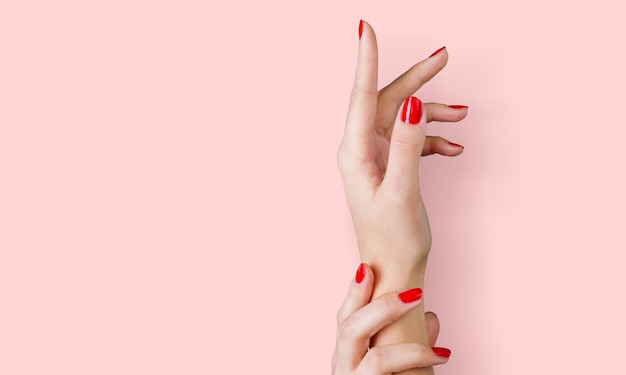 Delicate hands with beautiful manicure of a young woman