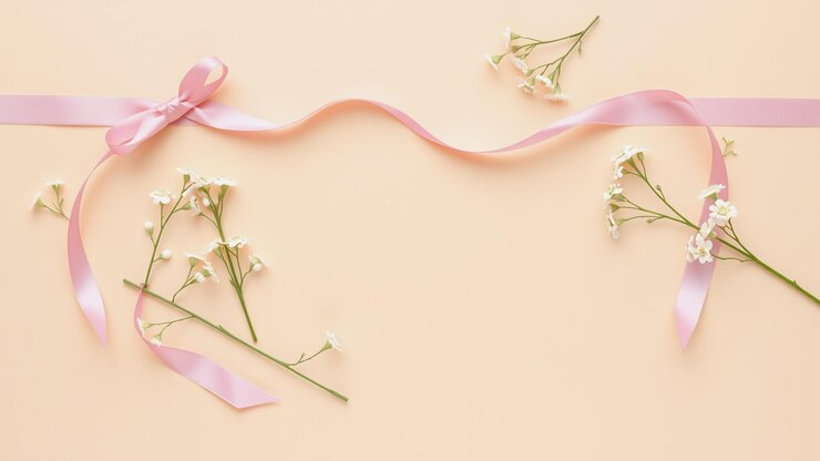 Photo 파스텔색 배경 에 있는 섬세 한 분홍색 리본 과  꽃