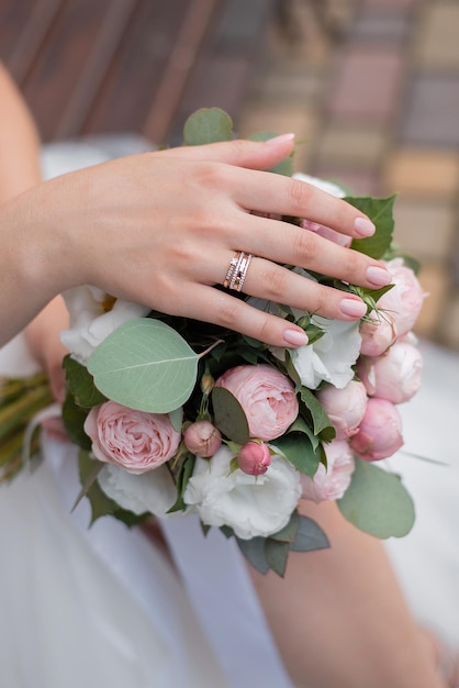 Delicate wedding bouquet in the hands of the bride idea for event agencies