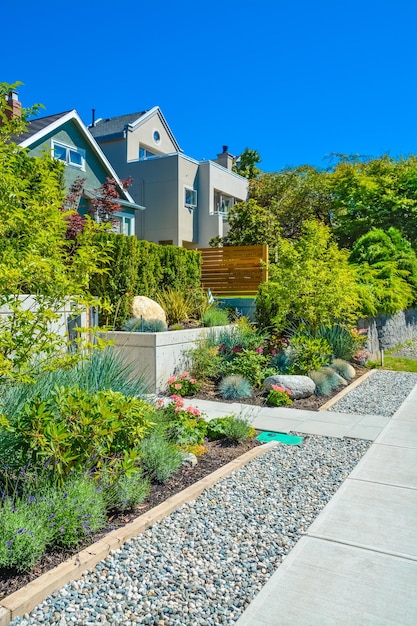 Delicatedly landscaped front yards of residential houses on a street