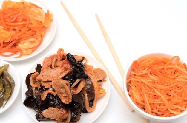 Delicious asian various salads with chopsticks and on white background Selective focus Asian food concept