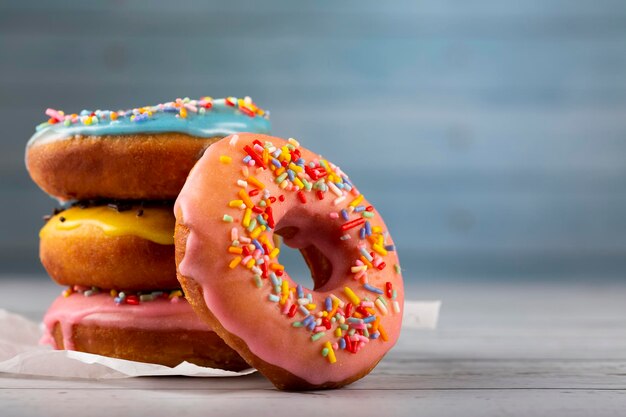 Delicious assorted colorful donuts on the table