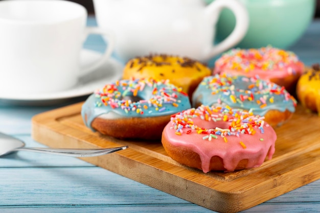Delicious assorted colorful donuts on the table