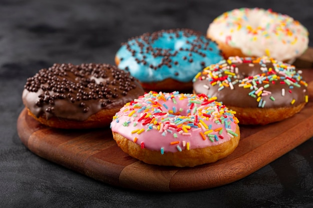 Delicious assorted colorful donuts on the table