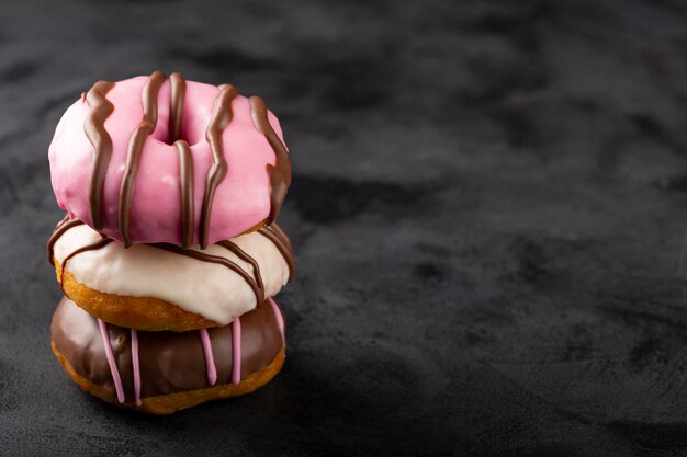 Delicious assorted colorful donuts on the table