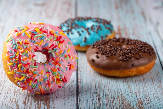 Delicious assorted colorful donuts on the table