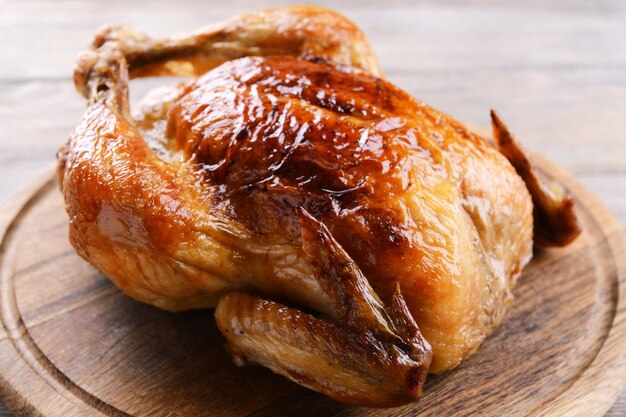 Roasted Chicken On Wooden Cutting Board Stock Photo, Picture and Royalty  Free Image. Image 46728169.