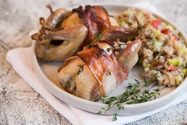 Delicious baked quail with bacon