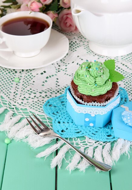 Delicious beautiful cupcake on dining table closeup