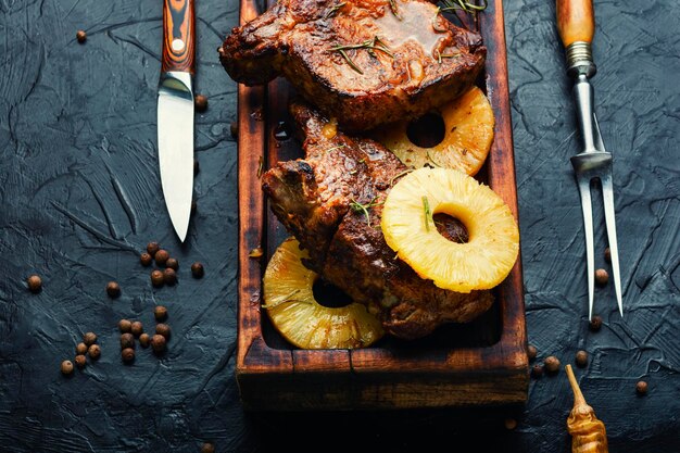 Delicious beef entrecote roasted with pineapple Tasty grilled meat