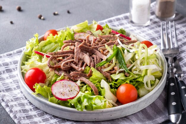 Delicious beef tongue salad on a plate