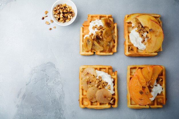 Delicious Belgian wafers with caramelized apple and pear and walnuts