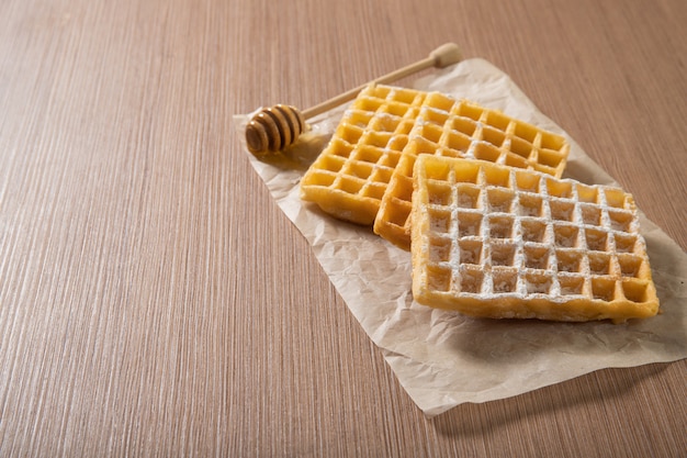 Delicious Belgian waffles with honey. Bakery products. Food