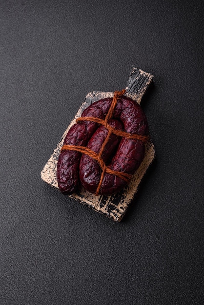 Delicious black blood sausage or black pudding with spices and herbs