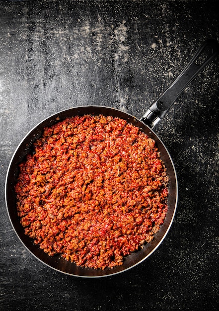 Delicious bolognese sauce in a frying pan