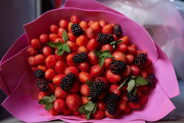 Delicious bouquet of strawberries and roses Close up