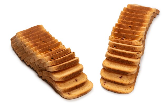 Delicious bread slices isolated on a white surface, top view.