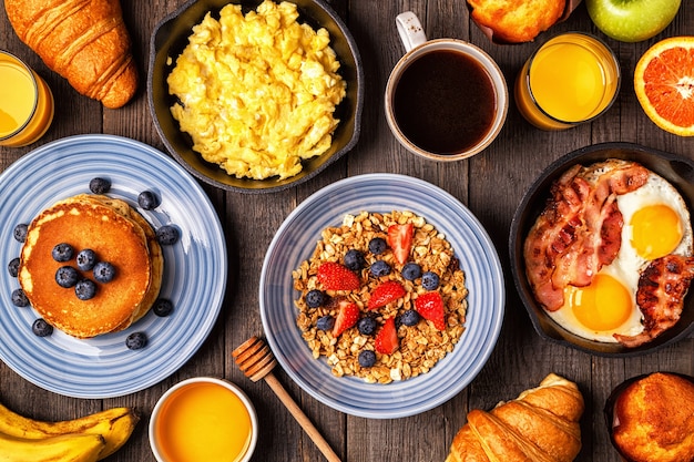 Delicious breakfast on a rustic table. Top view, copy space.