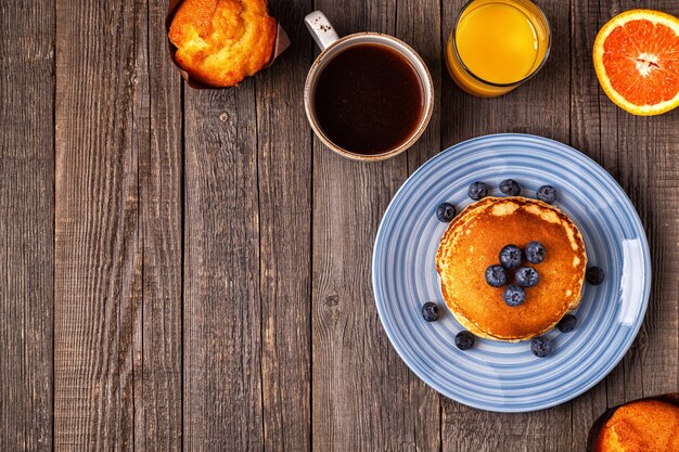 Delicious breakfast on a rustic table Top view copy space