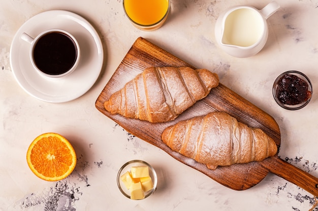 Delicious breakfast with fresh croissants and coffee