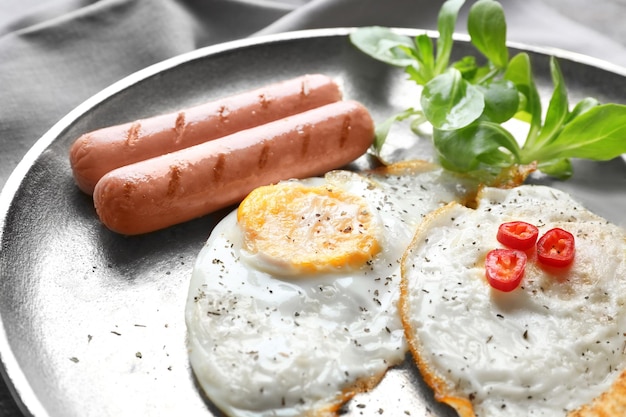 Delicious breakfast with over hard eggs closeup