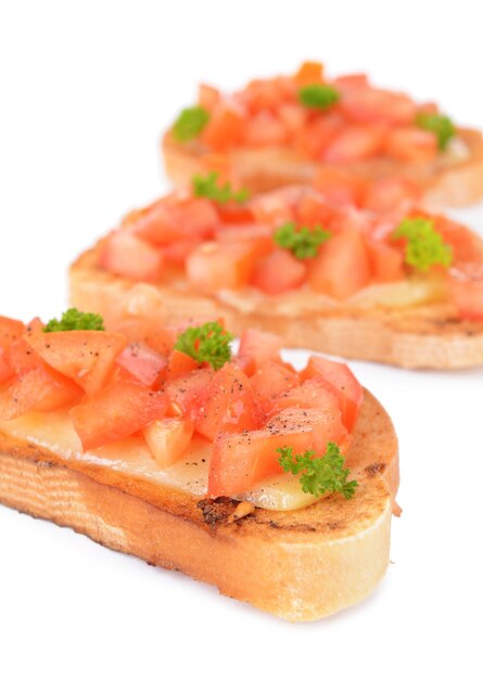 Delicious bruschetta with tomatoes isolated on white