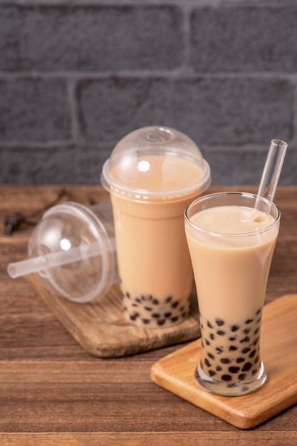 Delicious bubble milk tea with a straw in a glass