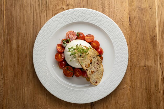 delicious buratta cheese on a white plate