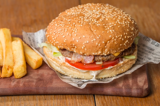 Delicious burger with beef, tomato, cheese and lettuce