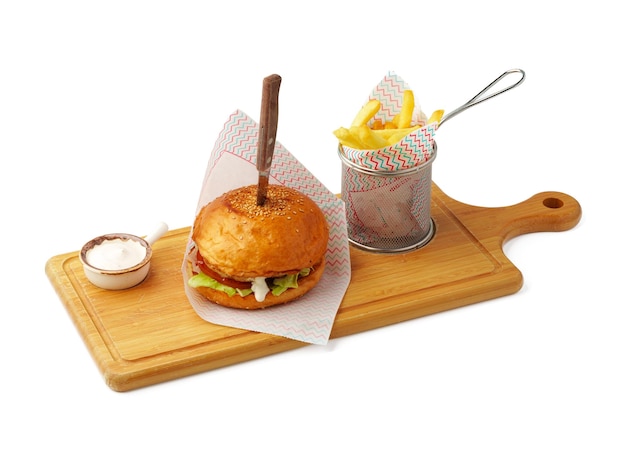 Delicious burger on wooden board isolated on white background