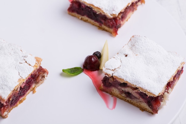 Delicious cake on a white plate, close-up