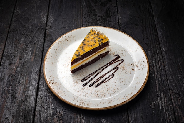 delicious cake with cream on a wooden background